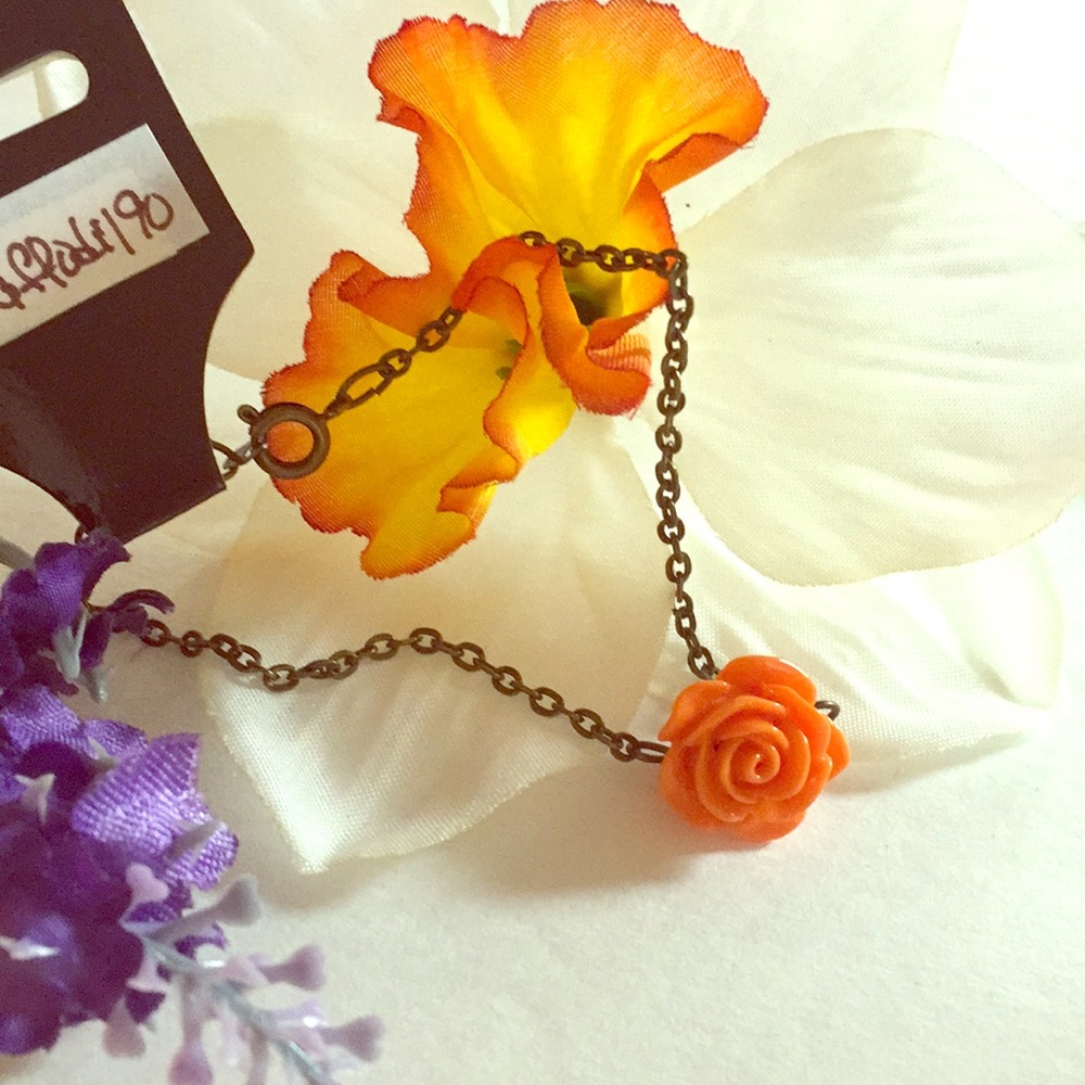 Orange flower bracelet.